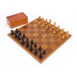 Boxwood and ebony chess set with case and folding chess board, the largest piece 5.5cm the board