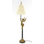 Gilt metal table lamp in the form of a mythical figure, overall 100cm high : For Further Condition