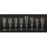 Eight 18th/19th century Champagne flutes with blade collars and knopped stems, the largest 15.5cm