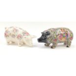 Two large porcelain piggy money banks including one hand painted with figures and flowers in the