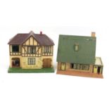 Two vintage wooden and tinplate doll's houses with furniture, the largest 53cm H x 62cm W x 47cm D :