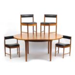 Mackintosh teak extending dining table and four chairs with black leather upholstery, numbered 9533,