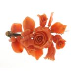 Victorian unmarked gold and coral brooch, carved with a bee in flowers, (tests as 12ct gold) 6cm
