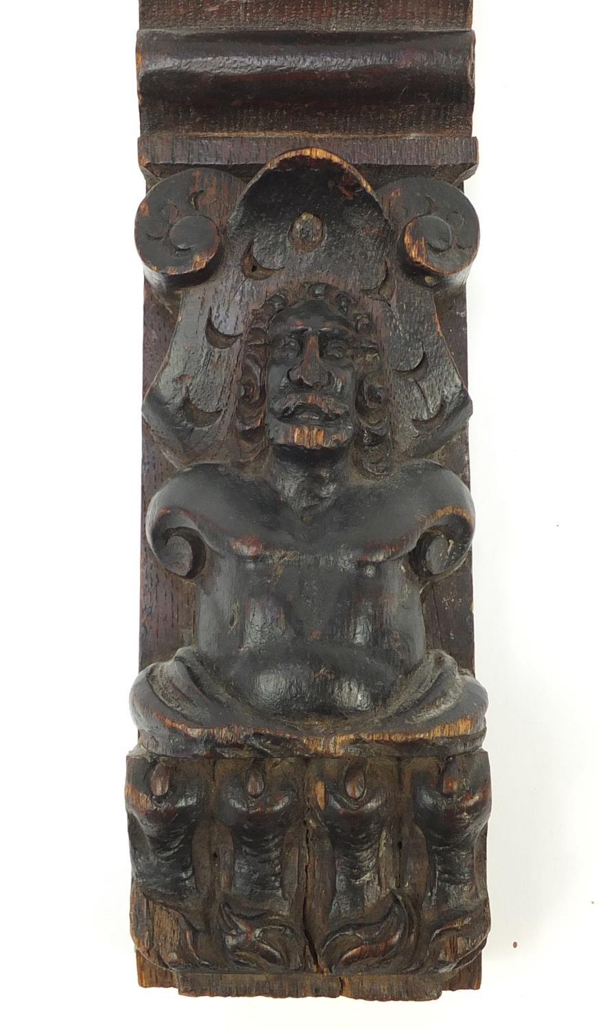 Early 17th century oak bracket carved with a gentleman in a hat and a royal crown, 31cm in - Image 5 of 7