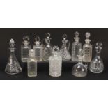 Eleven 19th century and later cut glass decanters and claret jugs, the largest 31cm high : For