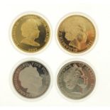 Four commemorative coins including Diamond Jubilee fifty pence and Nations Touch at Their Summits