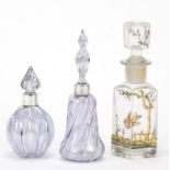 Two iridescent glass scent bottles with silver collars and a Continental example gilded and
