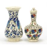 Two Islamic floral pottery vases including one with cover, the largest 11cm high : For Further