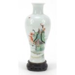Chinese porcelain baluster vase on carved hardwood stand, finely hand painted in the famille verte