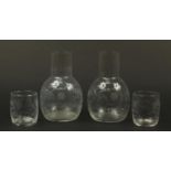 Pair of Victorian glass water carafes with tumblers, each etched with flowers, each 21cm high :