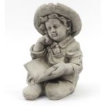 Garden stoneware figure of a young boy reading a book, 44cm high : For Further Condition Reports,