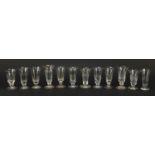 Twelve 18th/19th century faceted jelly glasses including some with star cut bowls, the largest