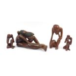Four modernist carved wood figures, the largest 52cm in length : For Further Condition Reports,