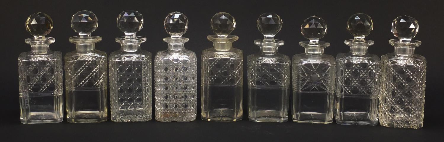 Nine 19th century cut glass decanters with stoppers, each approximately 22.5cm high : For Further