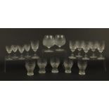 Victorian and Edwardian cut glassware including balloon tumblers and wine glasses, the largest