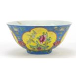 Chinese porcelain blue ground bowl hand painted in the famille rose palette with flowers, four