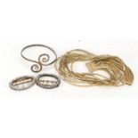 Christian Dior gilt metal necklace, silver coloured metal bangle and two Georgian style bangles, the