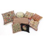 Eight Arts & Crafts style needlework cushions, the largest 38cm x 38cm : For Further Condition