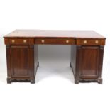 19th century mahogany inverted breakfront twin pedestal partner's desk with tooled leather top, each