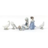 Lladro and Nao figures including a seated girl with geese and a set of three geese, the largest 18.