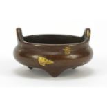 Chinese gold splashed patinated bronze tripod censer with twin handles, 6cm in diameter : For