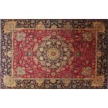 Hand made Iranian carpet with floral pattern onto a red and blue ground, 330cm x 243cm : For Further