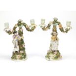 Pair of 19th century German Plaue porcelain floral encrusted two branch figural candlesticks , 32.