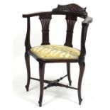 Edwardian mahogany corner chair with carved back rail and upholstered seat, 74cm high : For