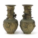 Pair of Chinese bronzed vases, relief decorated with dragons chasing a pearl amongst clouds, 25cm