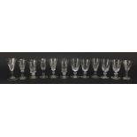 Twelve 18th/19th century faceted gin glasses including three with blade collars and knopped stems,