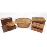 Two vintage suitcases and wicker including two picnic hampers, laundry basket and bread basket,