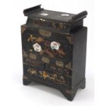 Japanese lacquered table cabinet fitted with an arrangement of drawers, painted and gilded with