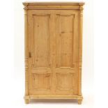 French pine cupboard with shaped panelled door enclosing four shelves, 172cm H x 104cm W x 50cm