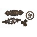 Four Victorian and later silver brooches including a green hard stone shamrock and a name brooch,