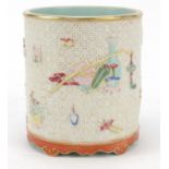 Chinese porcelain brush pot decorated in relief and hand painted in the famille rose palette with