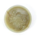 Chinese celadon green jade plaque carved with a bat amongst flowers, 6.5cm in diameter : For Further