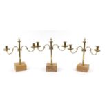 Three pairs of early 19th century three branch brass altar candelabras with turned columns, each