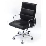 Chromium E Soft Pad easy chair by ICF raised on splayed feet terminating in five plastic casters,
