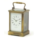 Large French brass cased carriage clock striking on a gong, retailed by Howell & James of London