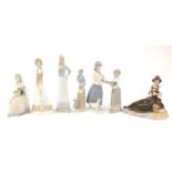 Lladro and Nao style figurines including one of a young girl feeding a bird, the largest 34cm high :