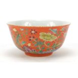 Chinese porcelain orange ground bowl, hand painted in the famille rose palette with blossoming