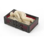 Alabaster carving of an Art Deco sleeping female housed in a leaded glass case, 10cm wide : For