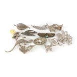 Silver and white metal brooches including marcasite and animals, the largest 9cm in length, 120.0g :