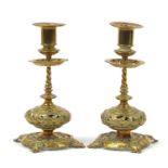 Pair of early 20th century Arts & Crafts style candlesticks, cast and pierced with leaves, 23cm high