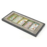 Chinese pewter tray housing five Canton enamel dishes, each hand painted with flowers, overall