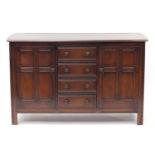 Ercol elm sideboard fitted with four drawers and two cupboard doors, 90cm H x 146cm W x 51cm D : For