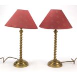 Pair of gilt brass barley twist table lamps raised on beaded circular bases, 37cm high : For Further