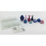 Colourful glass vases and scent bottles including Mdina and Caithness and a glass chess set : For