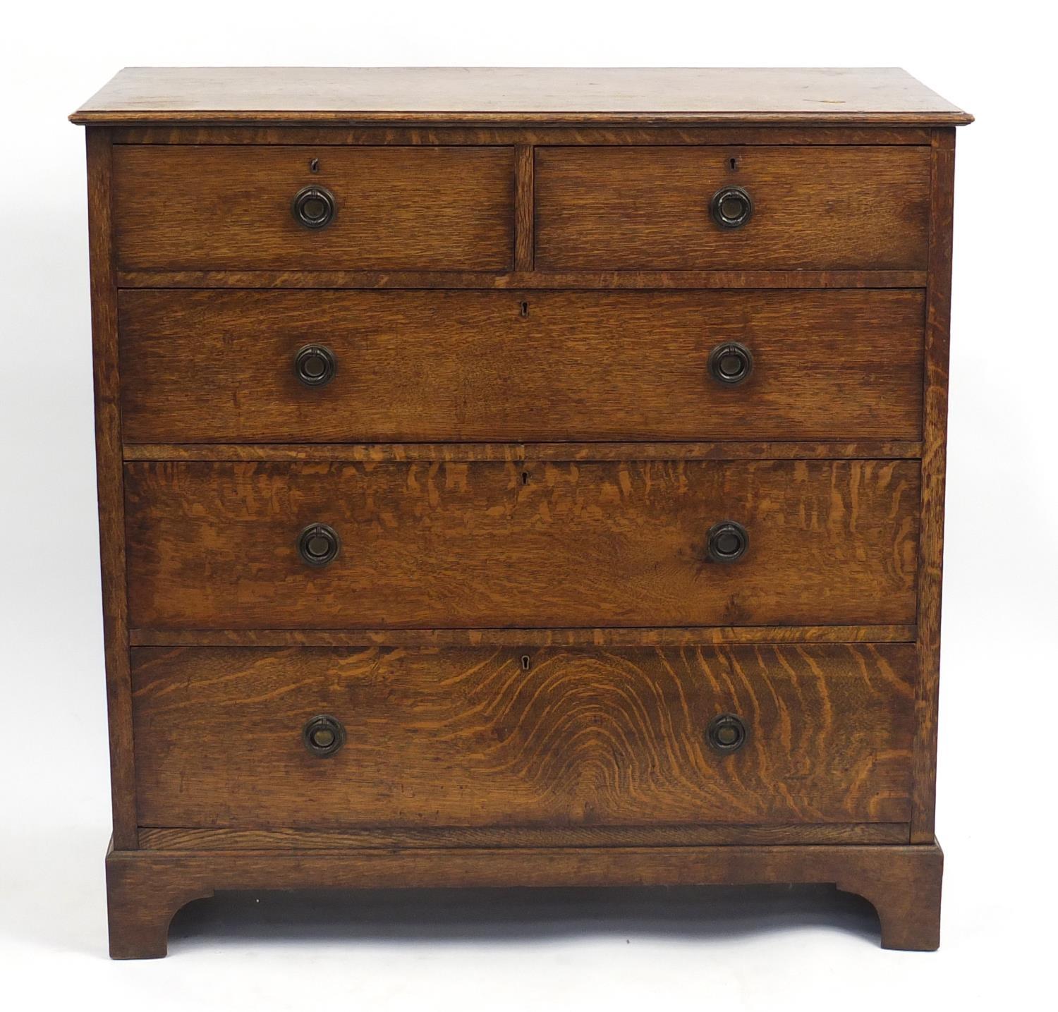 Edwardian oak five drawer chest fitted with two short above three long drawers, 107cm H x 116cm W
