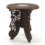 Indian hardwood folding table with ivory inlay carved with flowers, 34cm high x 30cm in diameter :